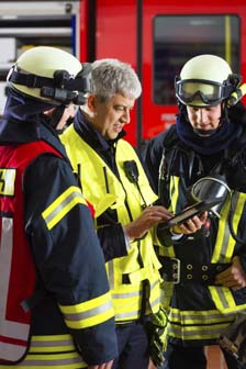 An emergency management director speaking with first responders.