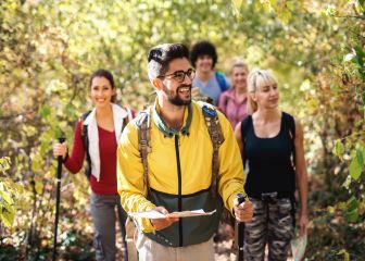 Group of people hiking with a guide.