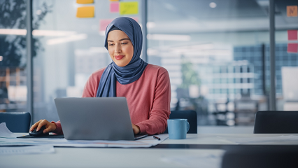 Woman working at a computer
