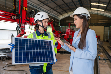 Female sales engineer displays solar panel. 