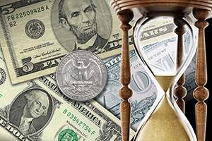 Dollar bills and coins scattered behind an hourglass image
